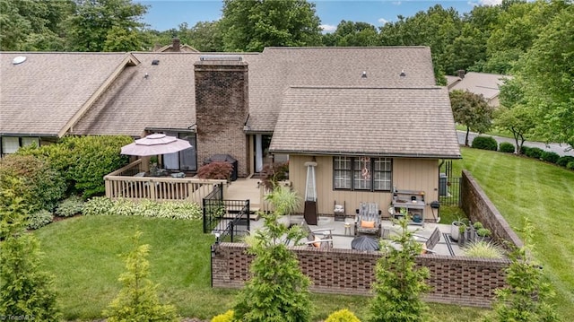 1312 Gilbrook Ct, High Point, NC 27262 - rear view of property featuring a chimney, a patio area, and a shingled roof