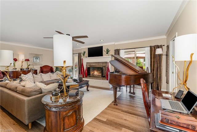 1312 Gilbrook Ct, High Point, NC 27262 - living area with crown molding, light wood finished floors, a brick fireplace, and ceiling fan