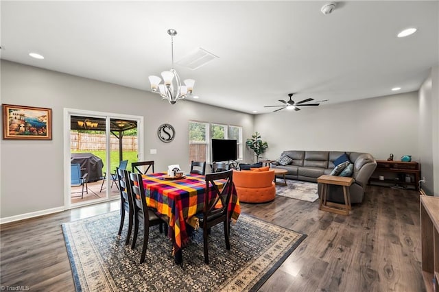 dining area with dark wood-style floors, a chandelier, ceiling fan, recessed lighting, and baseboards