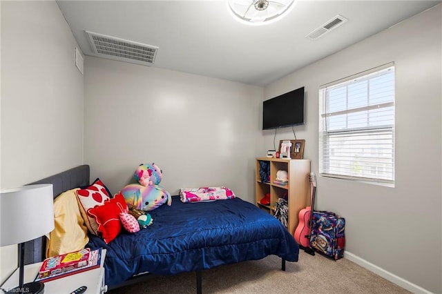 bedroom with carpet and baseboards