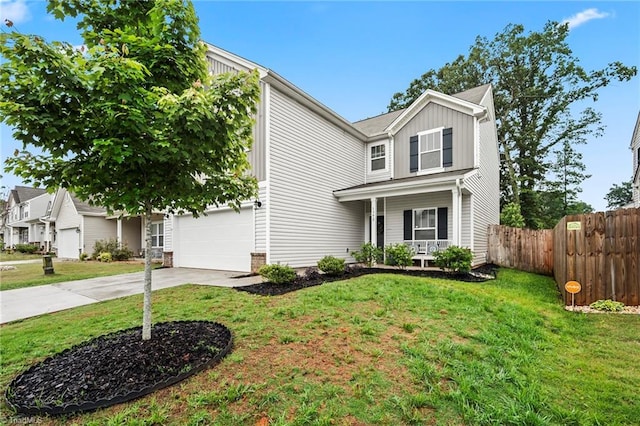 traditional home featuring driveway, a porch, and board and batten siding