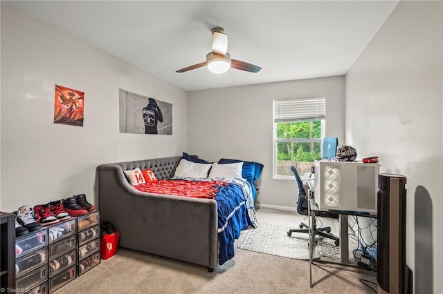 bedroom with carpet floors, a ceiling fan, and baseboards