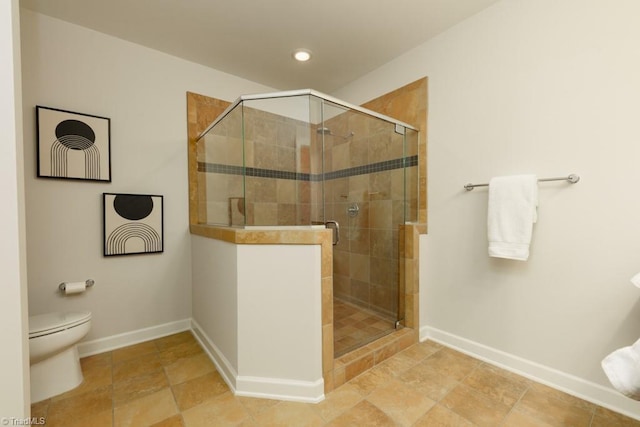 full bath with a shower stall, toilet, and baseboards