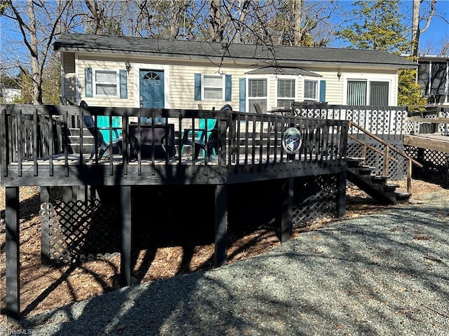 back of property featuring a wooden deck