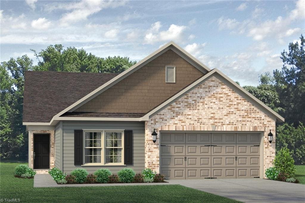 1926 Darrell Dr Lot 13, Graham, NC 27253 - view of front of property featuring a garage, driveway, and brick siding