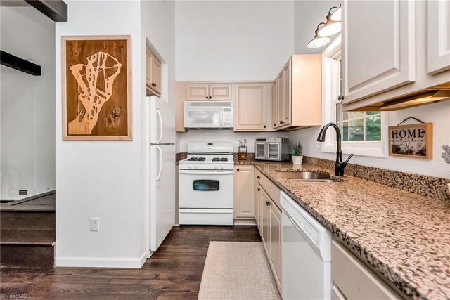 kitchen featuring dark wood-type flooring, white appliances, ceiling fan, and beamed ceiling