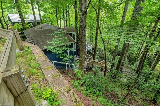 view of property exterior featuring a deck