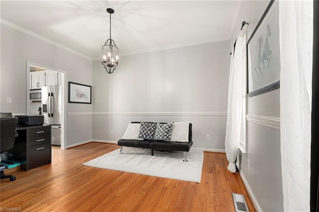interior space featuring light wood-style floors, crown molding, a notable chandelier, and visible vents