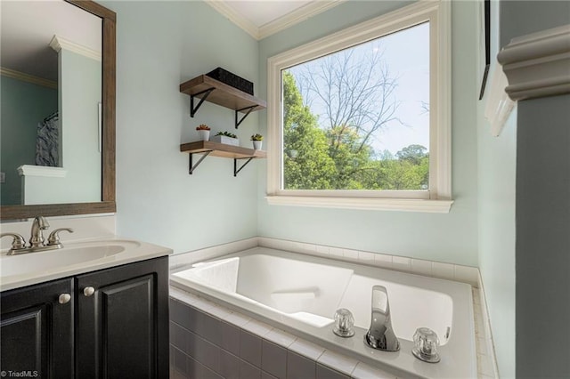 full bath featuring vanity, ornamental molding, and a garden tub