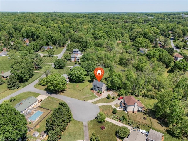 aerial view featuring a view of trees