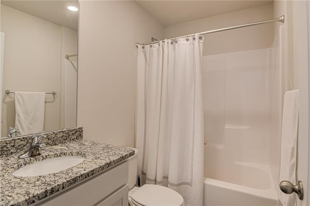 full bathroom featuring vanity, shower / tub combo with curtain, and toilet