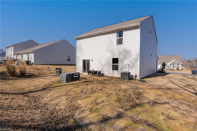 rear view of property featuring cooling unit