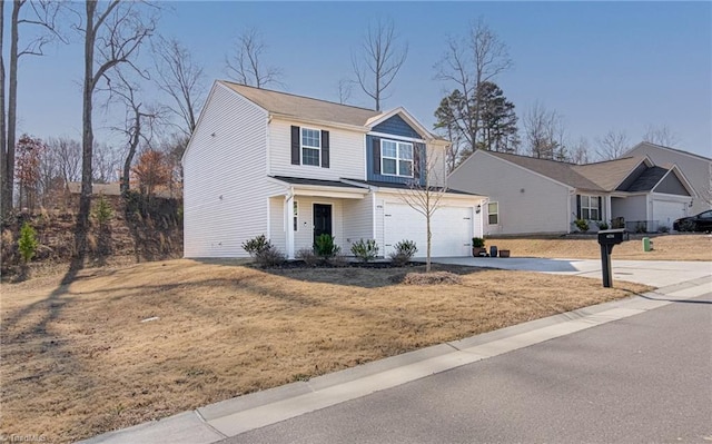 view of front property with a garage and a front yard