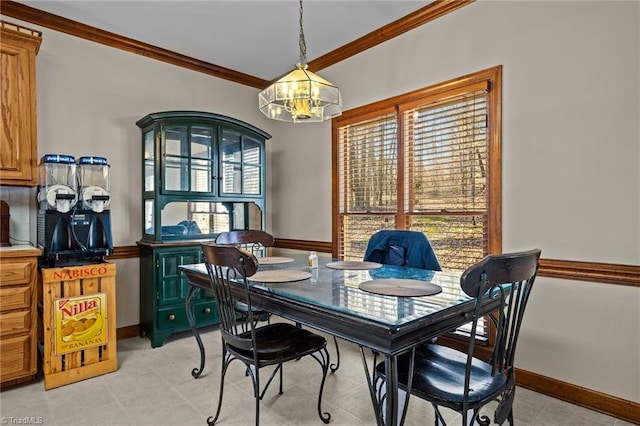 dining space featuring ornamental molding