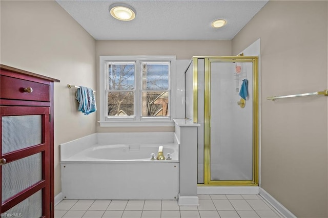 bathroom with tile patterned floors, a textured ceiling, and plus walk in shower