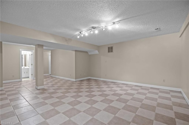 basement with track lighting