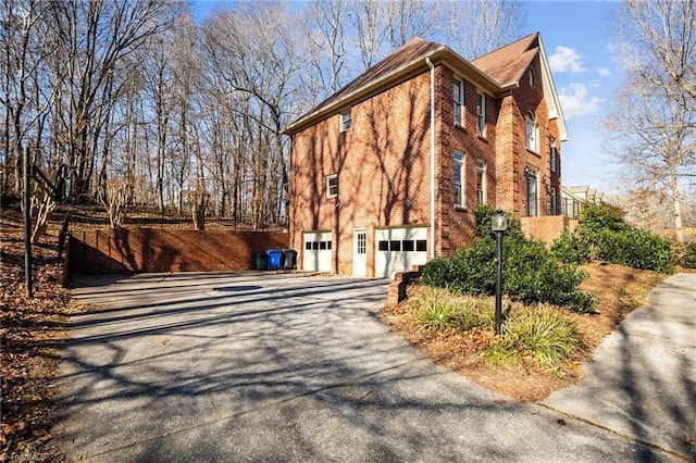 view of property exterior featuring a garage