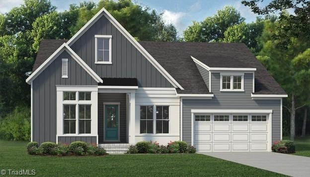 view of front of home featuring a garage and a front lawn