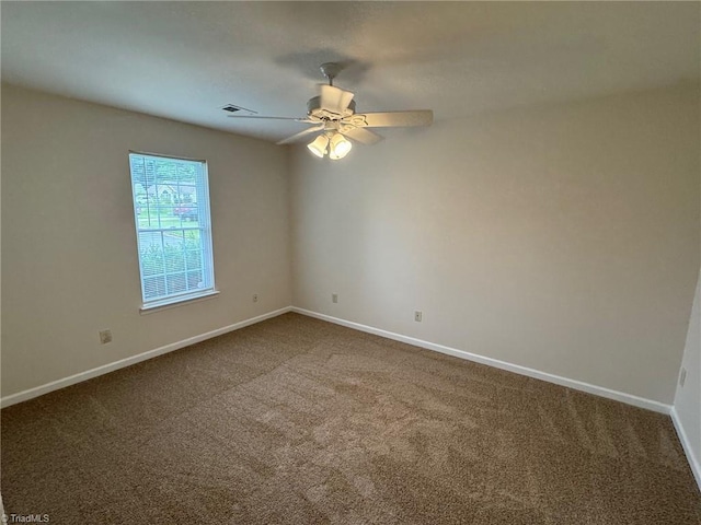 8 Franklinwood Dr, Greensboro, NC 27401 - spare room featuring dark carpet, baseboards, and ceiling fan