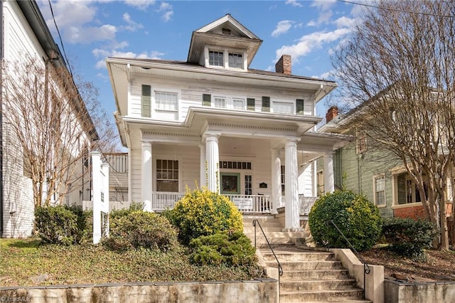 neoclassical home featuring covered porch