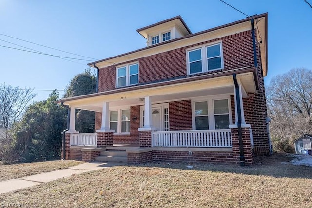 view of front of house featuring a porch and a front yard