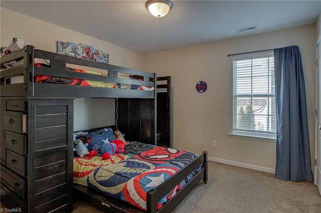 bedroom with light colored carpet