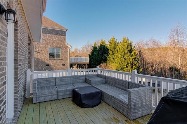 wooden deck with an outdoor hangout area