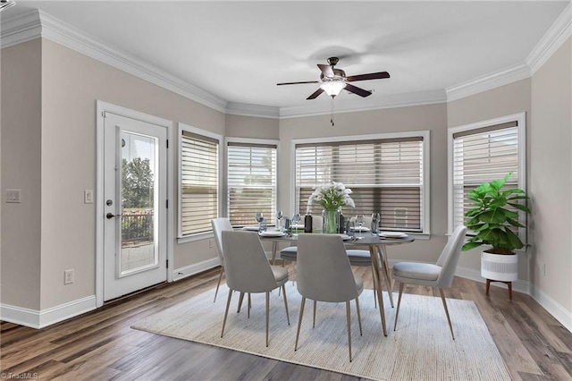 dining room featuring ceiling fan, ornamental molding, and hardwood / wood-style flooring