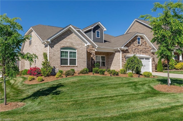 view of front facade featuring a garage and a front yard