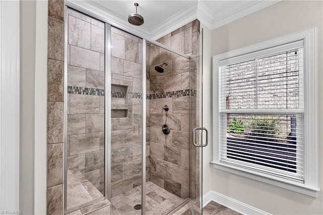 bathroom featuring walk in shower, a healthy amount of sunlight, and ornamental molding