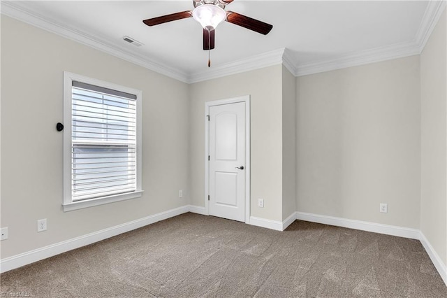 unfurnished room with carpet floors, crown molding, and ceiling fan