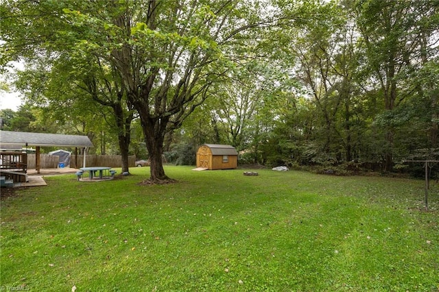 view of yard featuring a shed and a deck