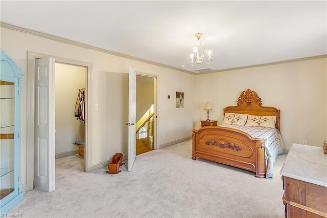 carpeted bedroom featuring a walk in closet, a closet, crown molding, baseboards, and a chandelier