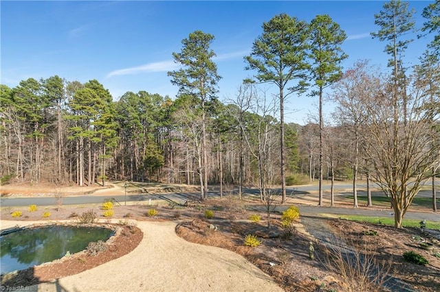 view of community with a forest view