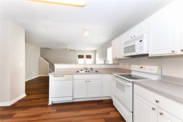320 Apple Ridge Rd, Greensboro, NC 27406 - kitchen with white appliances, a sink, a ceiling fan, white cabinetry, and a peninsula