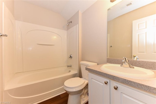 320 Apple Ridge Rd, Greensboro, NC 27406 - bathroom with toilet, bathing tub / shower combination, vanity, wood finished floors, and lofted ceiling