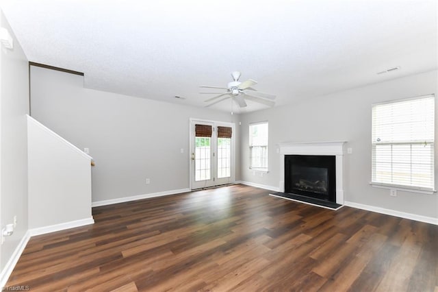 320 Apple Ridge Rd, Greensboro, NC 27406 - unfurnished living room with a ceiling fan, wood finished floors, and baseboards