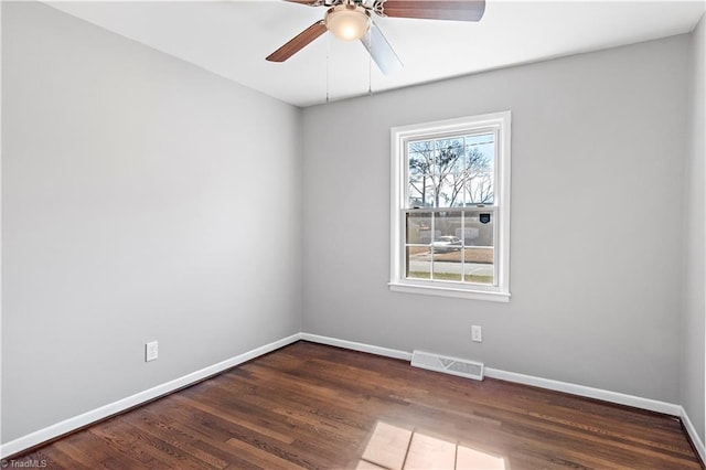 unfurnished room featuring dark hardwood / wood-style flooring and ceiling fan