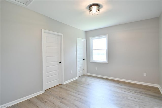 2244 US Highway 64 E, Mocksville, NC 27028 - unfurnished bedroom with light wood finished floors and baseboards