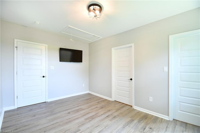 2244 US Highway 64 E, Mocksville, NC 27028 - unfurnished room with attic access and wood finished floors