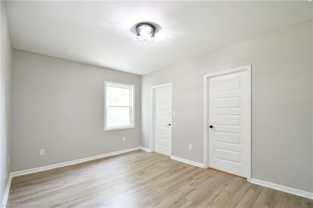 2244 US Highway 64 E, Mocksville, NC 27028 - unfurnished bedroom featuring wood finished floors and baseboards