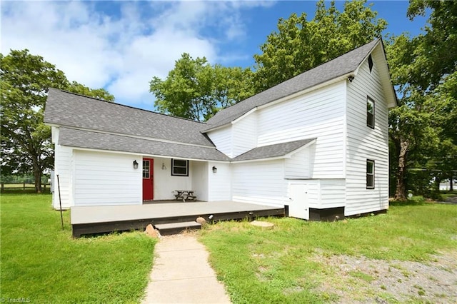 2244 US Highway 64 E, Mocksville, NC 27028 - view of front of house featuring a deck, a front lawn, and roof with shingles