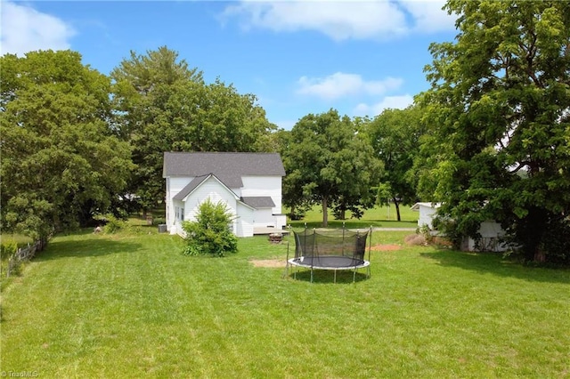 2244 US Highway 64 E, Mocksville, NC 27028 - view of grassy yard with a trampoline