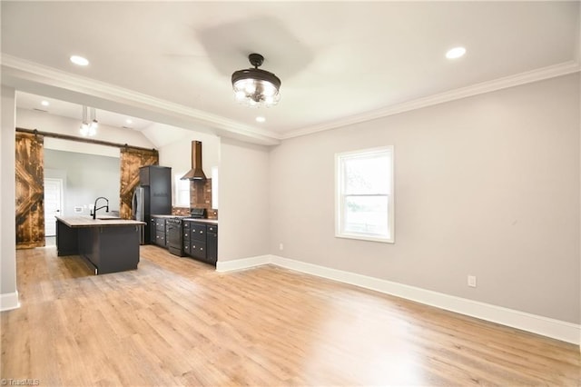 2244 US Highway 64 E, Mocksville, NC 27028 - unfurnished living room with a barn door, light wood finished floors, crown molding, and recessed lighting