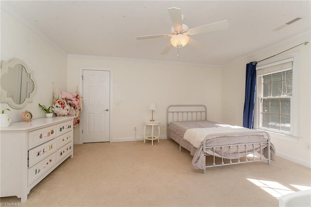 bedroom with a ceiling fan, light colored carpet, crown molding, and baseboards