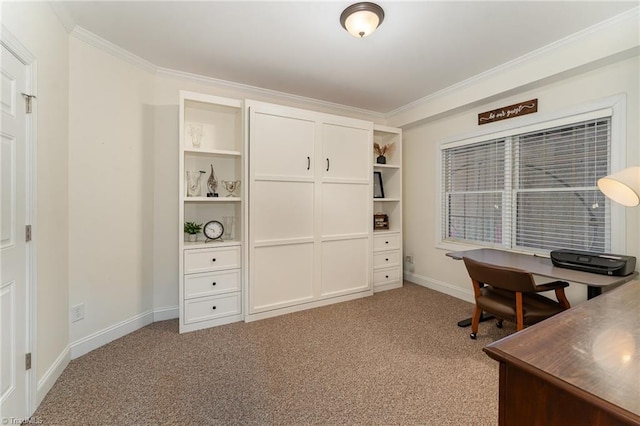 carpeted office space with baseboards and crown molding