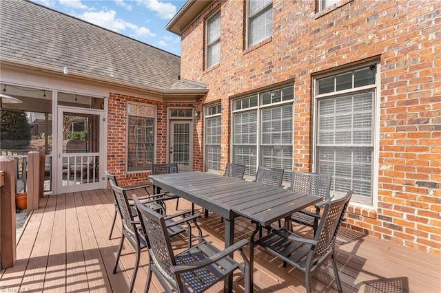 wooden deck with outdoor dining space