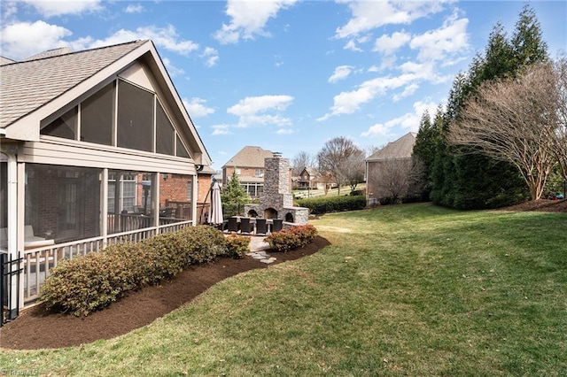 view of yard with a sunroom