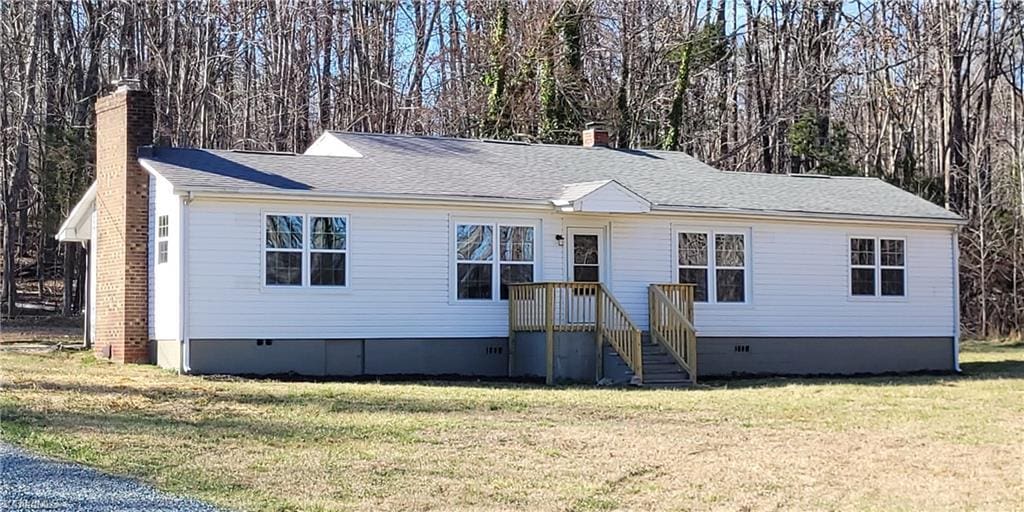 single story home featuring a front yard, crawl space, and a chimney