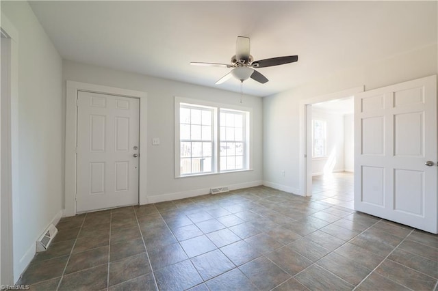 1473 Briarcliff Dr, Asheboro, NC 27205 - foyer entrance featuring visible vents, baseboards, ceiling fan, and dark tile patterned flooring